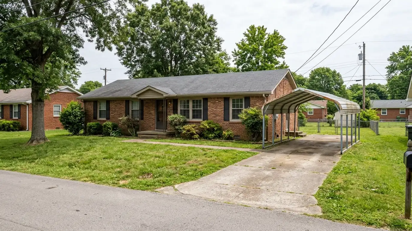 A Antioch, Tennessee home with a neat custom shed, a carport and a detached garage in a landscaped yard